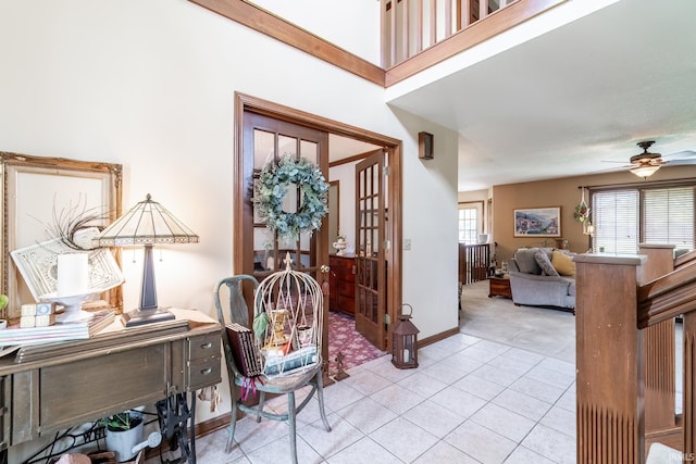 15329 Laurel Ridge Pl, Leo, IN 46765 - foyer entrance with light colored carpet, ceiling fan, light tile patterned floors, and baseboards