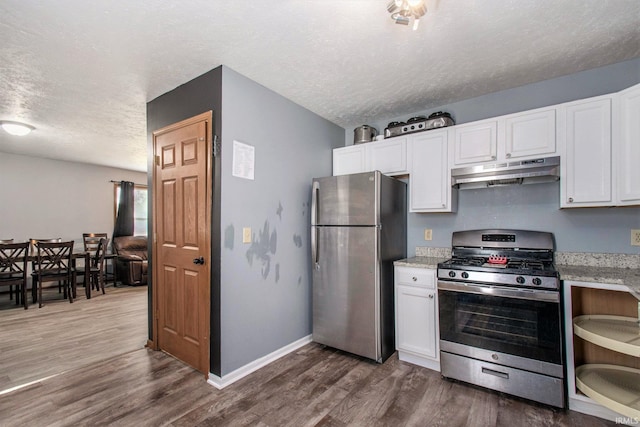 1849 N Meade St, South Bend, IN 46628 - kitchen with stainless steel appliances, under cabinet range hood, a textured ceiling, white cabinetry, and dark wood-style floors