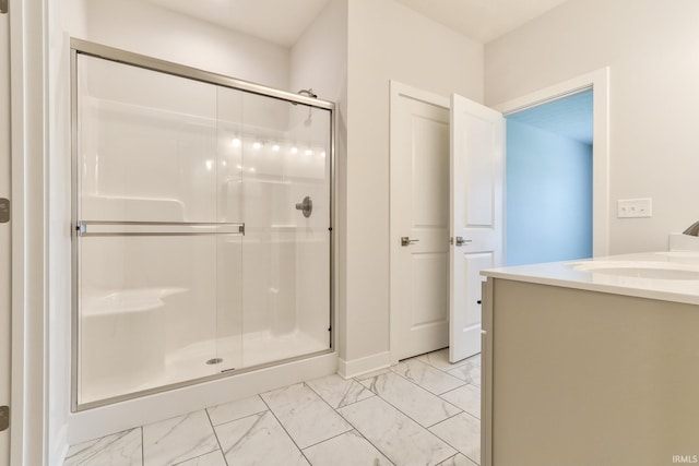 5708 Abbe Wood Dr, Newburgh, IN 47630 - full bath with marble look tiles, a shower stall, vanity, and baseboards