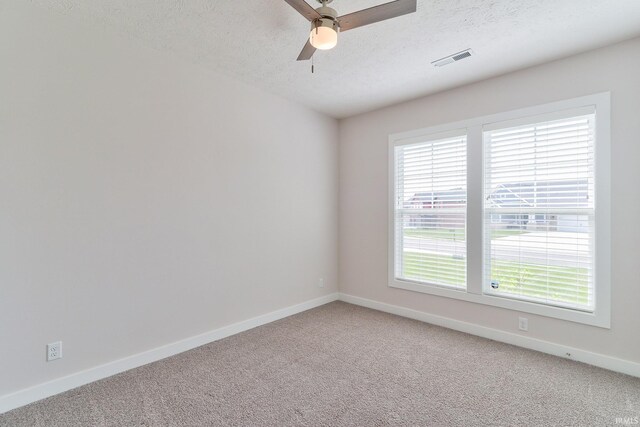 5708 Abbe Wood Dr, Newburgh, IN 47630 - unfurnished room with light carpet, baseboards, a ceiling fan, and a textured ceiling