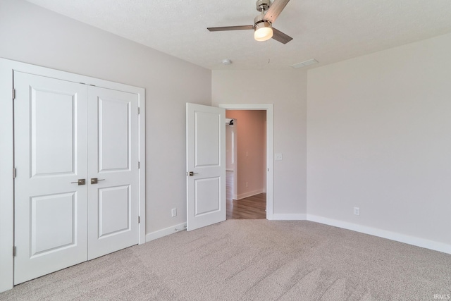 5708 Abbe Wood Dr, Newburgh, IN 47630 - unfurnished bedroom with carpet flooring, baseboards, a closet, and a ceiling fan
