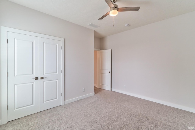 5708 Abbe Wood Dr, Newburgh, IN 47630 - unfurnished bedroom featuring light carpet, baseboards, a closet, and a ceiling fan