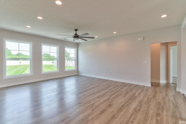 5708 Abbe Wood Dr, Newburgh, IN 47630 - empty room with a ceiling fan, recessed lighting, light wood-style floors, and baseboards