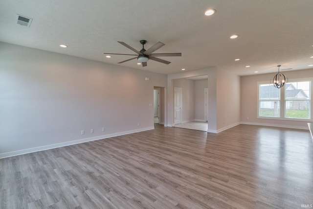 5708 Abbe Wood Dr, Newburgh, IN 47630 - spare room with recessed lighting, light wood finished floors, a chandelier, ceiling fan, and baseboards
