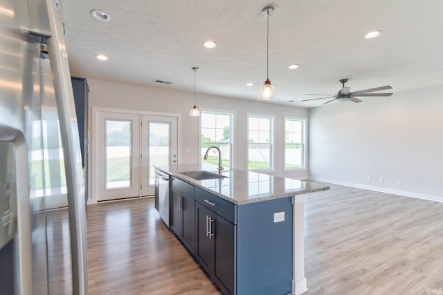 5708 Abbe Wood Dr, Newburgh, IN 47630 - kitchen with a sink, recessed lighting, light wood-type flooring, appliances with stainless steel finishes, and a ceiling fan