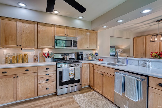 713 Carole Pl, Newburgh, IN 47630 - kitchen with stainless steel appliances, a sink, light brown cabinetry, and recessed lighting