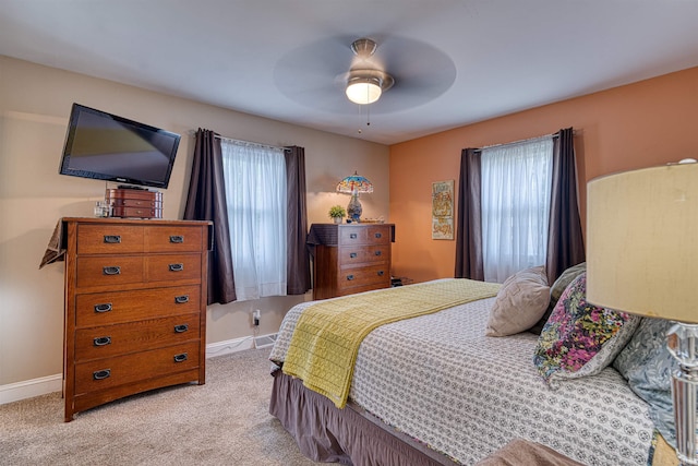 713 Carole Pl, Newburgh, IN 47630 - bedroom featuring multiple windows, carpet flooring, baseboards, and a ceiling fan