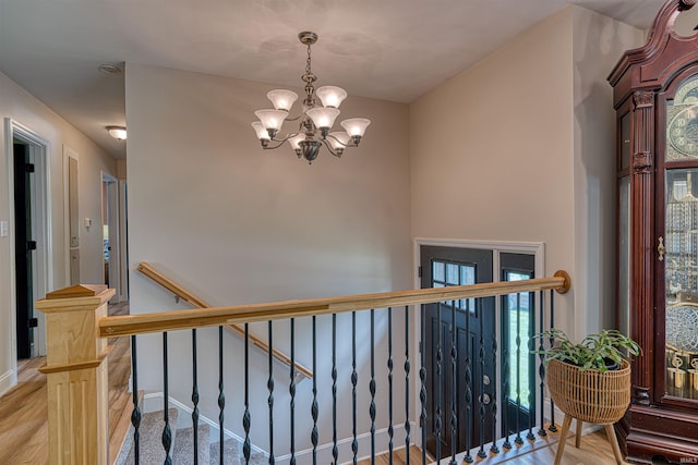 713 Carole Pl, Newburgh, IN 47630 - stairs with a chandelier and wood finished floors