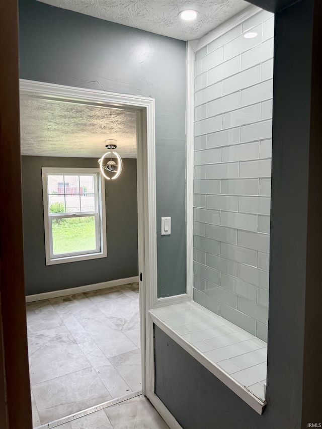 406 W N St, Kokomo, IN 46901 - bathroom featuring a textured ceiling, marble finish flooring, and baseboards