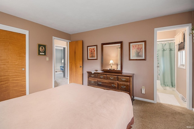 26966 Heather Ln, Elkhart, IN 46514 - bedroom featuring carpet floors, baseboards, and connected bathroom