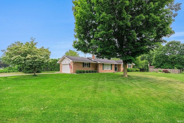 26966 Heather Ln, Elkhart, IN 46514 - ranch-style house with an attached garage, a chimney, brick siding, and driveway