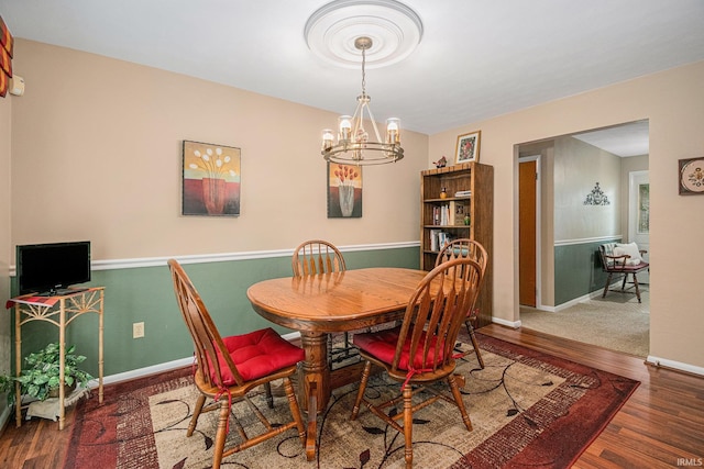 26966 Heather Ln, Elkhart, IN 46514 - dining room with a chandelier, wood finished floors, and baseboards