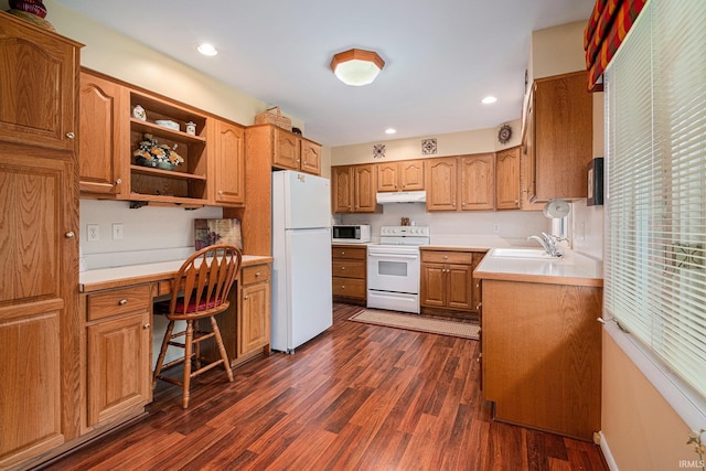 26966 Heather Ln, Elkhart, IN 46514 - kitchen with white appliances, under cabinet range hood, a sink, dark wood-style flooring, and light countertops