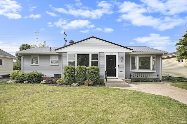 519 W 12th St, Mishawaka, IN 46544 - bungalow-style house featuring metal roof, a standing seam roof, a front yard, and a chimney