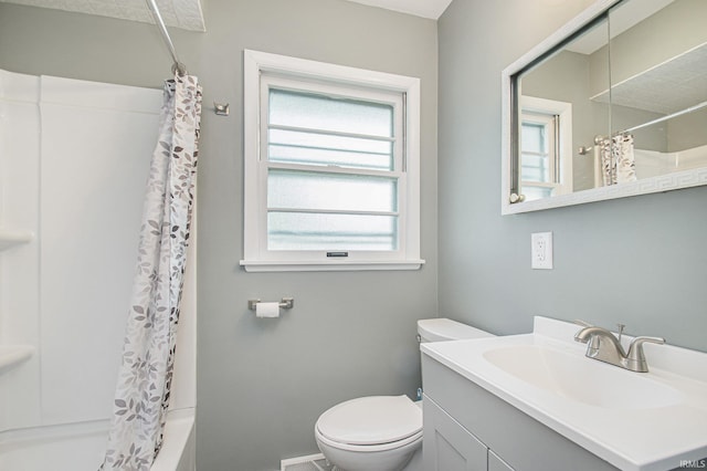 519 W 12th St, Mishawaka, IN 46544 - full bathroom with toilet, vanity, shower / bath combination with curtain, and baseboards