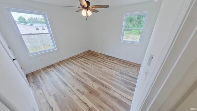 30050 Wren St, Elkhart, IN 46517 - empty room with light wood-style flooring, ceiling fan, and baseboards