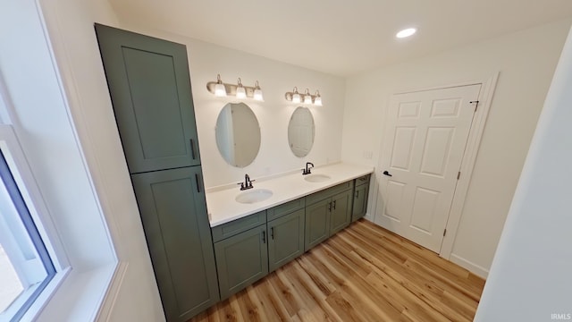 30050 Wren St, Elkhart, IN 46517 - bathroom featuring double vanity, wood finished floors, and recessed lighting