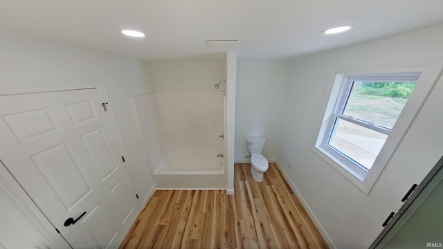 30050 Wren St, Elkhart, IN 46517 - bathroom featuring toilet, shower / bath combination, wood finished floors, baseboards, and recessed lighting