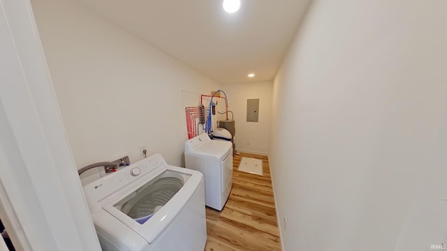 30050 Wren St, Elkhart, IN 46517 - washroom with electric panel, washing machine and clothes dryer, light wood-style flooring, and recessed lighting