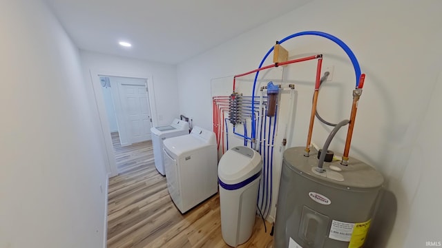 30050 Wren St, Elkhart, IN 46517 - washroom featuring water heater, washing machine and clothes dryer, and light wood-style flooring