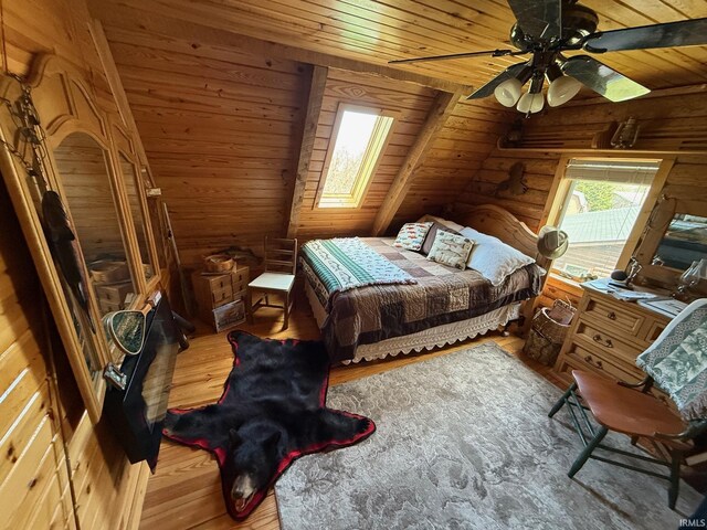 1764 County Road 66th Rd, Auburn, IN 46706 - bedroom featuring wooden ceiling, wood finished floors, rustic walls, vaulted ceiling, and a ceiling fan