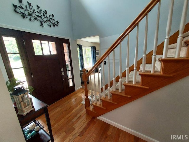 394 Saint Charles St, Jasper, IN 47546 - foyer featuring baseboards, wood finished floors, and stairs
