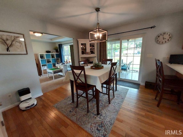 394 Saint Charles St, Jasper, IN 47546 - dining area with a chandelier, light wood-style flooring, plenty of natural light, and baseboards