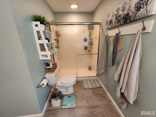 394 Saint Charles St, Jasper, IN 47546 - full bathroom with toilet, a shower stall, and baseboards