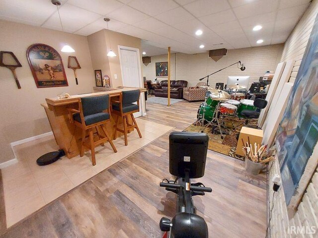 394 Saint Charles St, Jasper, IN 47546 - playroom with baseboards, a drop ceiling, light wood finished floors, recessed lighting, and bar area