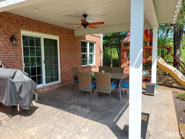 394 Saint Charles St, Jasper, IN 47546 - view of patio featuring a playground, outdoor dining space, a ceiling fan, and area for grilling