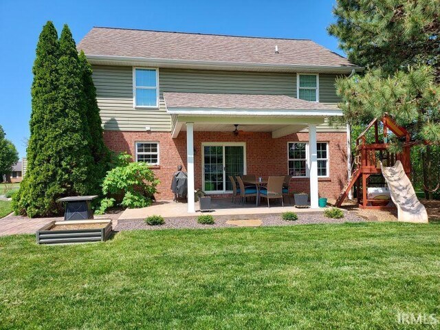 394 Saint Charles St, Jasper, IN 47546 - rear view of property with a patio area, ceiling fan, a playground, and brick siding