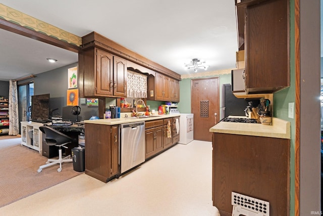 332 W Tyland Blvd, New Haven, IN 46774 - kitchen with dishwasher, a sink, washer / dryer, light countertops, and freestanding refrigerator