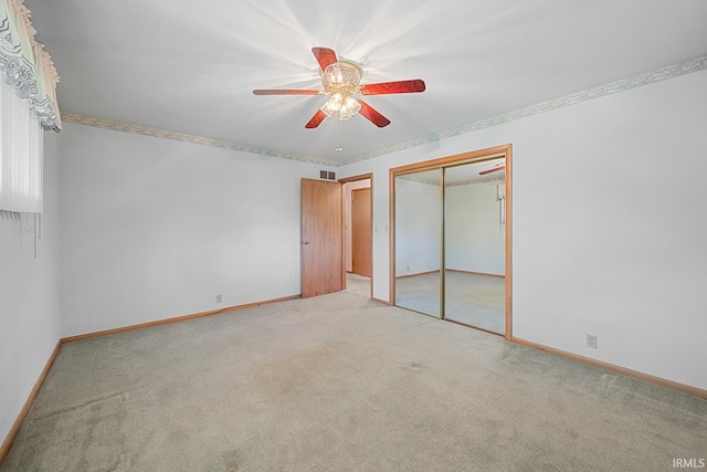 14 Brady Ct, Lafayette, IN 47909 - unfurnished bedroom with carpet floors, baseboards, a closet, and a ceiling fan
