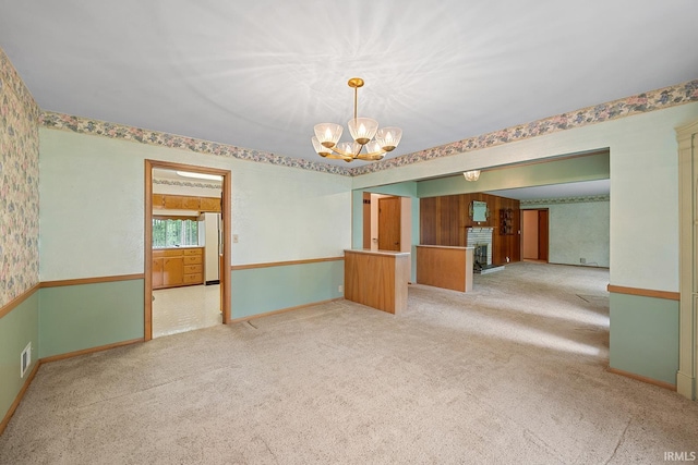 14 Brady Ct, Lafayette, IN 47909 - carpeted empty room with a chandelier and baseboards