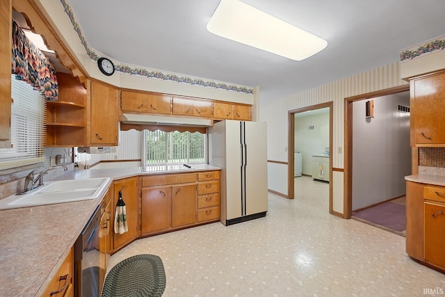 14 Brady Ct, Lafayette, IN 47909 - kitchen featuring freestanding refrigerator, a sink, washing machine and clothes dryer, under cabinet range hood, and stainless steel dishwasher