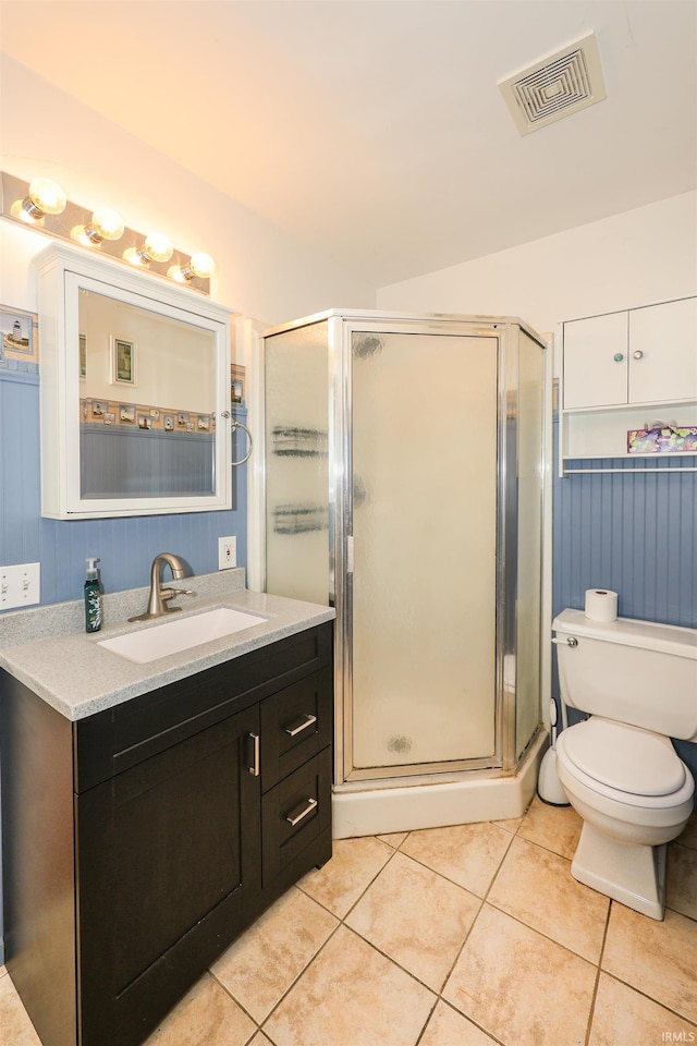 17111 Antwerp Rd, Harlan, IN 46743 - full bathroom with vanity, tile patterned flooring, a shower stall, and toilet