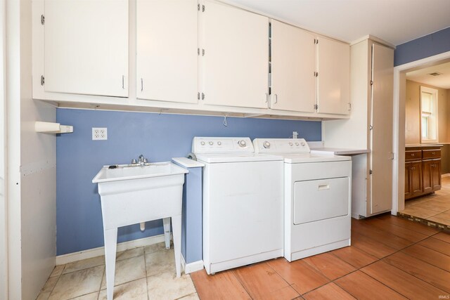 17111 Antwerp Rd, Harlan, IN 46743 - washroom with cabinet space and washer and dryer