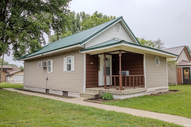 400 S Main St, Knox, IN 46534 - rear view of house featuring a lawn, metal roof, and cooling unit