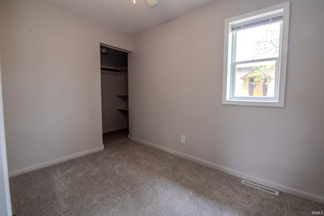 400 S Main St, Knox, IN 46534 - unfurnished bedroom with carpet flooring, baseboards, and a closet