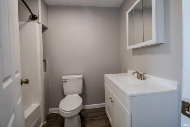 400 S Main St, Knox, IN 46534 - bathroom featuring vanity, toilet, wood finished floors, and baseboards