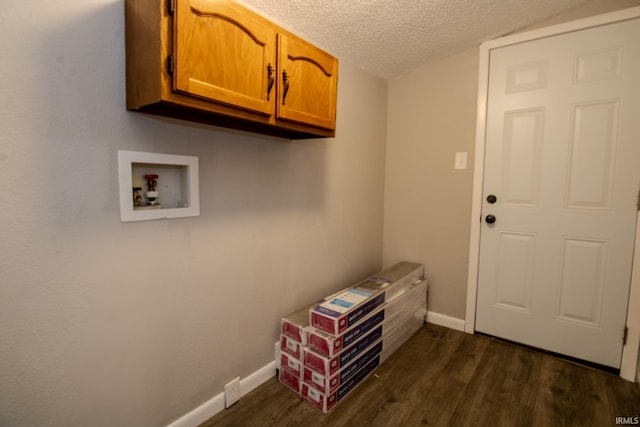 400 S Main St, Knox, IN 46534 - laundry room with cabinet space, washer hookup, a textured ceiling, dark wood-style flooring, and baseboards