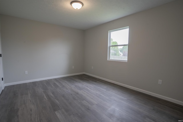 1109 E 6th St, Fowler, IN 47944 - spare room with dark wood finished floors and baseboards