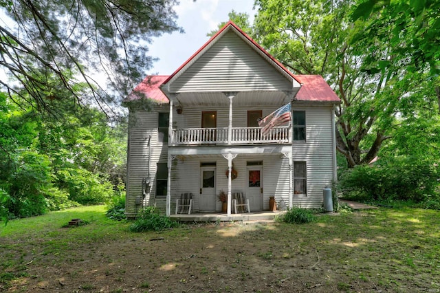9469 W Sinclair Rd, Birdseye, IN 47513 - rear view of property featuring a balcony, covered porch, and metal roof