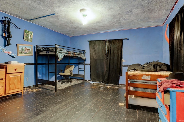 9469 W Sinclair Rd, Birdseye, IN 47513 - bedroom featuring hardwood / wood-style flooring and a textured ceiling