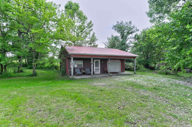 9469 W Sinclair Rd, Birdseye, IN 47513 - view of front of home with a front yard and metal roof
