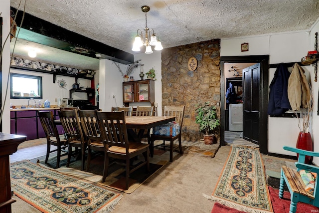 9469 W Sinclair Rd, Birdseye, IN 47513 - dining space with a chandelier, a textured ceiling, and light carpet