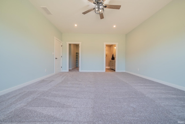 848 W S St, Upland, IN 46989 - unfurnished bedroom with light carpet, baseboards, a walk in closet, recessed lighting, and ensuite bath