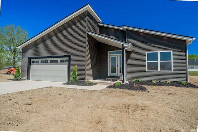848 W S St, Upland, IN 46989 - view of front of house with concrete driveway and an attached garage
