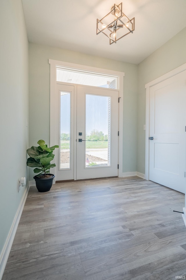 848 W S St, Upland, IN 46989 - entryway featuring a chandelier, wood finished floors, and baseboards