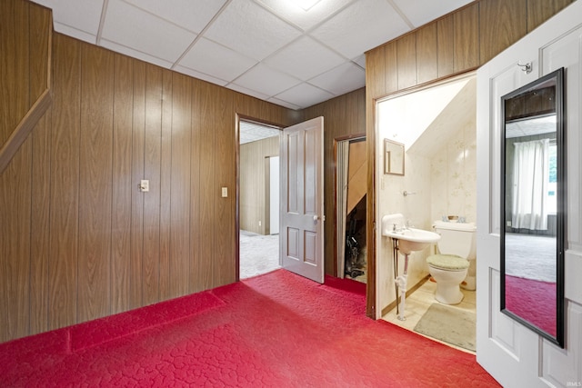 1202 S Van Buren St, Auburn, IN 46706 - corridor featuring carpet floors, wood walls, and a drop ceiling